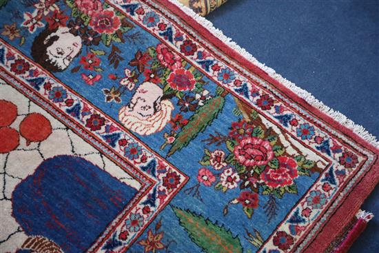 A Kashan pictorial red ground rug, 6ft 9in by 4ft 4in.